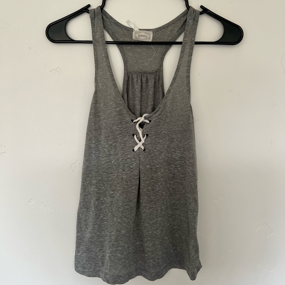 Grey flowy shirt with tie over breast area